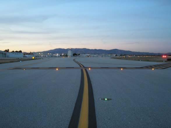 The runway guard lights are amber in color and flush mounted into the pavement surface