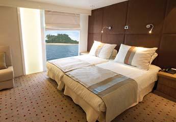The ocean-view, stylishly appointed cabins are designed to accommodate two twin beds or one double bed and feature two windows, marble-accented private bathroom with