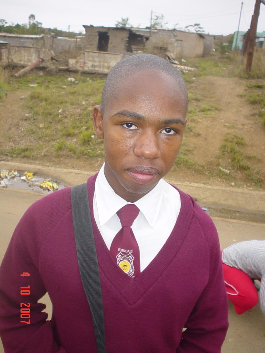 Hi, my name is Ndumiso Ngcobo. (Ndumiso means praising). This is me on the photo below. I am one of the children supported by Sinethemba Trust.