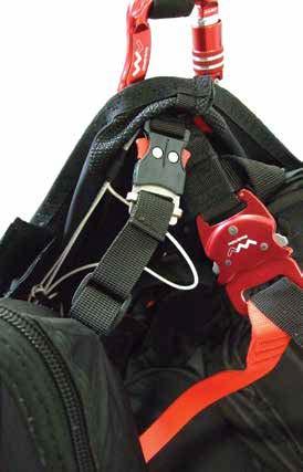the harness by connecting the loops on the restraint ropes to the karabiners: