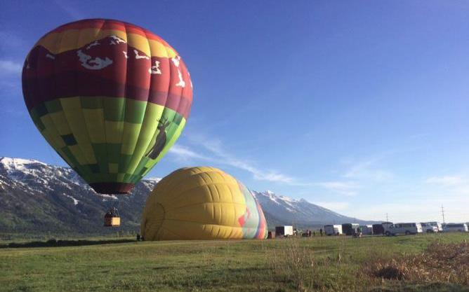 EXPLORING BY AIR FLOATING IN THE TETONS BY HOT AIR BALLOON MAY END OF OCTOBER Hot air ballooning above the valley is an awe-inspiring beginning to the day.