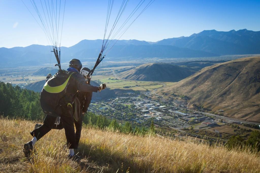 EXPLORING BY AIR TANDEM PARAGLIDING LATE MAY EARLY OCTOBER This experience is truly for the most adventurous of travelers.