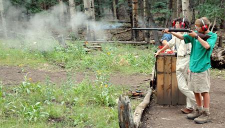 Scouts trekking the Philmont backcountry can load and shoot black powder rifles.