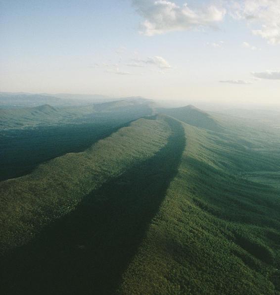 These ridges are also part of the Appalachian Mountain System. M ost of the ridges rise between three and four thousand feet.
