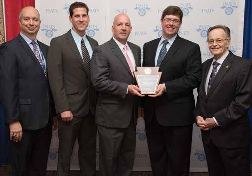 Awards PHIA Managing Director Jason Wagner, second from right, presents the 35 th Annual Road and Bridge Safety Improvement Award to John Foley, center, chairman of Derry Township, Dauphin County.
