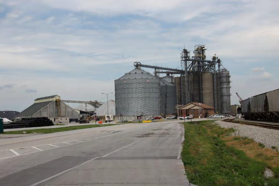 During daylight, the facility off loads trucks carrying grain and at night covered hoppers loaded with grain.