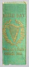 Estimate: $ 100 - $ 150 $ 40 Lot # 26 - Green Ribbon with "Irish Day", "World's Fair Chicago 1893." Written in gold along with a picture of a liar with shamrocks around it.