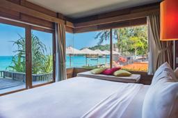 Each room features a private balcony or patio area overlooking the stylish sun terrace and infinity pool, with beautiful views of the stunning beach and ocean backdrop.