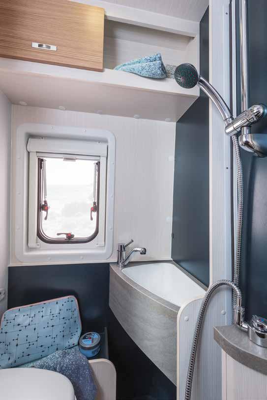 The fixed bathroom (below) comes with our patented air chamber shower curtain, which prevents the