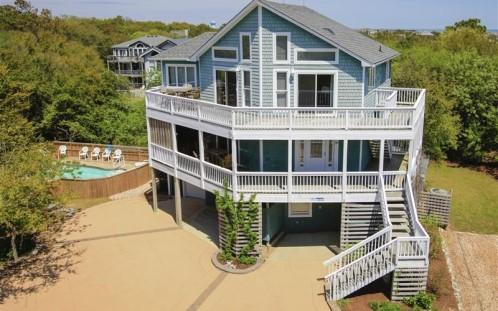 boasting plenty of ocean views, a private pool, movie theater and game room, and easy town and beach access (the beach is 800 feet from your front door).