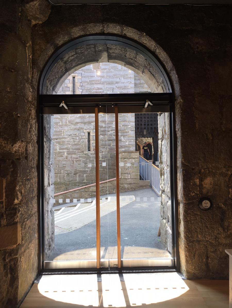 Main entrance approach to Castle Rushen showing outward opening glass doors with Touch to Open button Cloak Room Facilities Castle Rushen does not have a dedicated