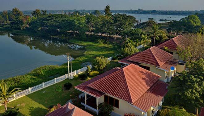 WIN UNITY HOTEL, Monywa Deluxe bungalows look out to the lake Deluxe room.