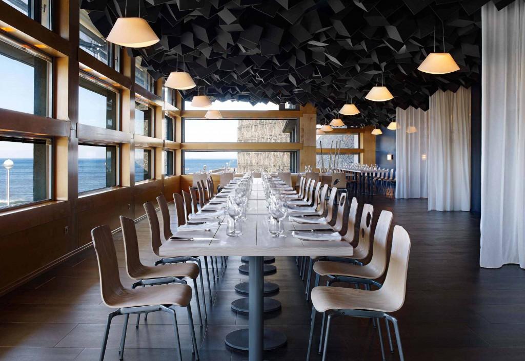 it into a new culinary-cultural space," and turned to Atelier Laia to design their house-ware, menu, graphics, signings and interior The building has two floors, with on the ground floor a terrace,
