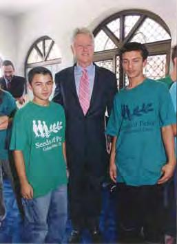 Tefik Agushi (l) and Demo Demiri (r) pictured here with former President Bill Clinton, in Prishtina, in September 2003, participated in 2002.
