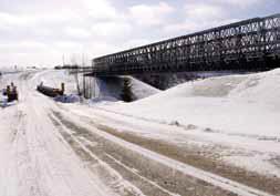 INSTALLATION OF BRIDGES TO LENGTHEN WINTER ROAD SEASON In the long term, the unreliable, seasonal ice roads that service the isolated communities on the east side will be replaced by the all-season