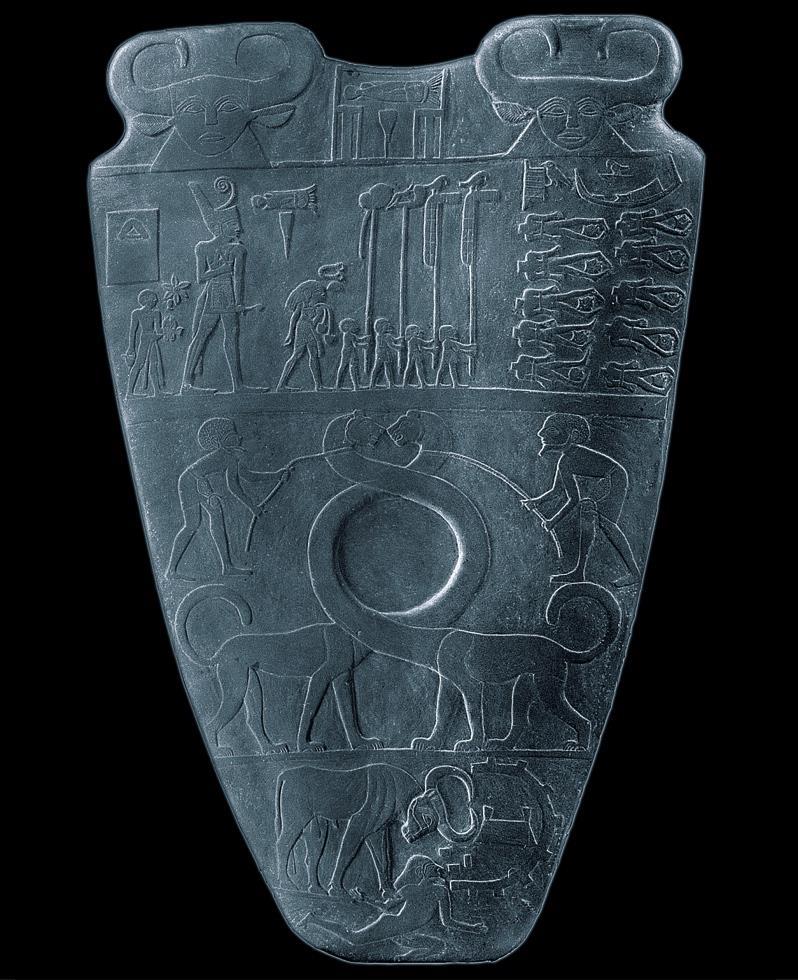 On the left Narmer is slaying two foes at once, the man and the falcon, a symbol for the pharoah.
