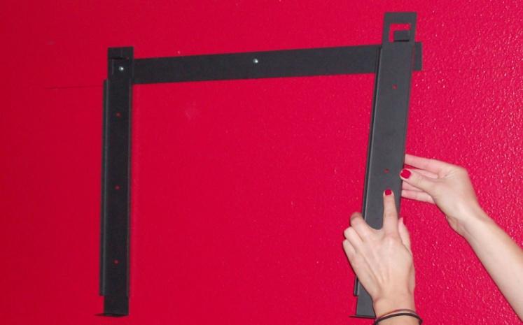 Place the horizontal bracket on the wall in line with the anchors and using the anchor screws secure and tighten the