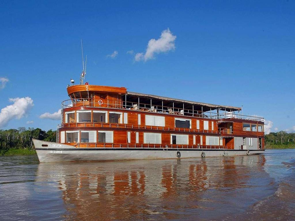 DELFIN II LUXURY AMAZON RIVER CRUISE 28 Passengers Its fourteen large guest suites include four masters suites with 180º panoramic windows and ten
