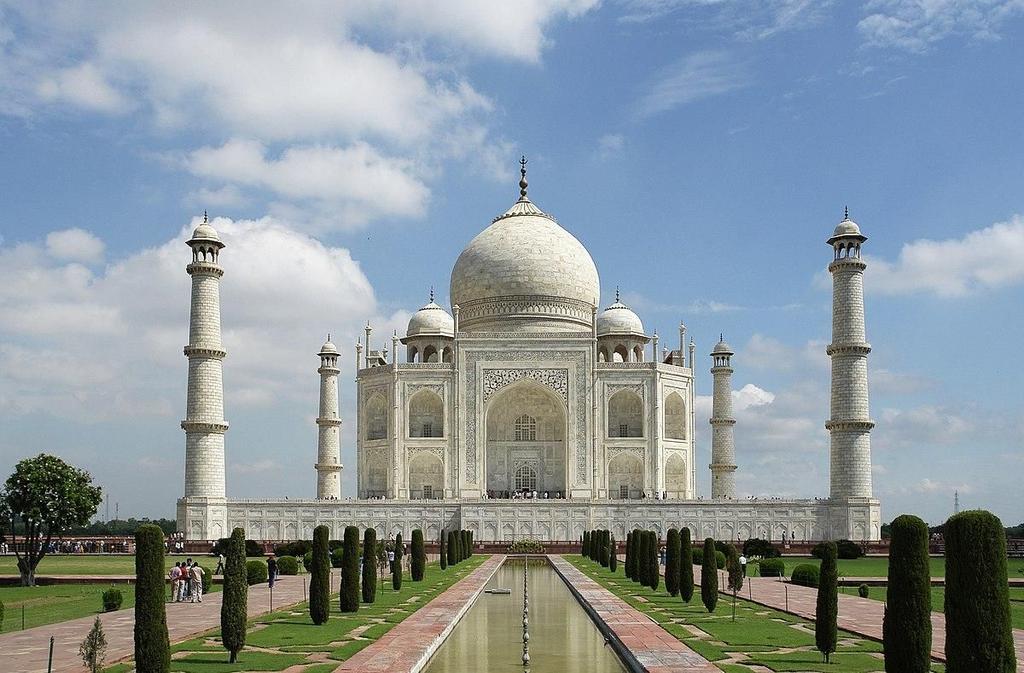 One of the New Seven Wonders of the World is the Taj Mahal. Located in India, this fancy monument is made of white marble. It is decorated with sparkling gems. But what is this amazing building?
