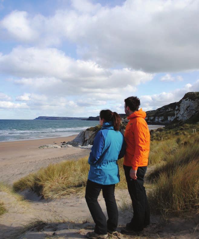 This area derives its name from the striking limestone cliffs that line the back of the beach. Follow the route markers up to the road and turn left beside the tarmac.