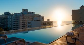 and comfort with spectacular views and sunset views over the sea. The hotel has a gym & spa, a big rooftop swimming pool and spacious events rooms.