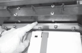 Having more than one person trying to change knives invites accidents. 1. Use the "Knife Change" rocker switch to move the knife bar to the bottom of it's stroke. 2.