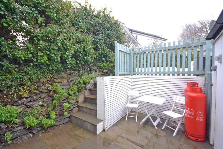 Between the external doors off the kitchen and dining room is a smart paved courtyard which enjoys complete privacy and is the ideal space for al