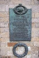 Memorial plaque to French soldiers on the wall of the Cloth Hall The Cloth Hall also houses the In Flanders Field museum, which is a good place to visit to gain