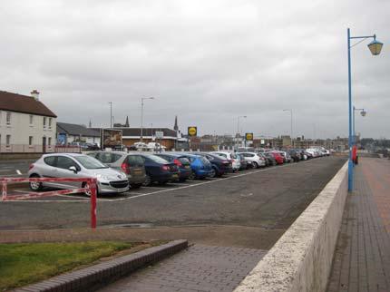The promenade showing the adjacent car parking and grass verges. The Proposed Scheme The scheme is illustrated on Figures 5.2a to 5.2e Scheme Design General Arrangement.