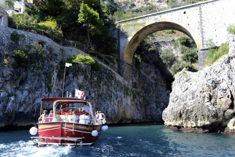 AMALFI BOAT TOUR FROM NERANO Transfer to Nerano by van, sailing the Amalfi coast passing close Li Galli Islets and photo stop twice: once in Positano and once in Amalfi where both you will have free