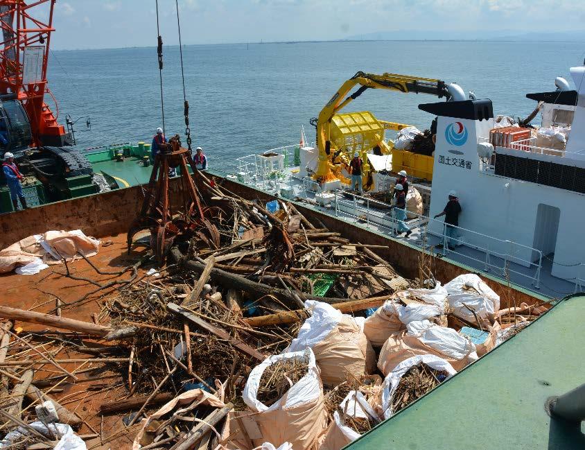 Driftwood removal at sea. Marine environment maintenance ship Kaiki to collect driftwood in Cooperation with fishery cooperatives.