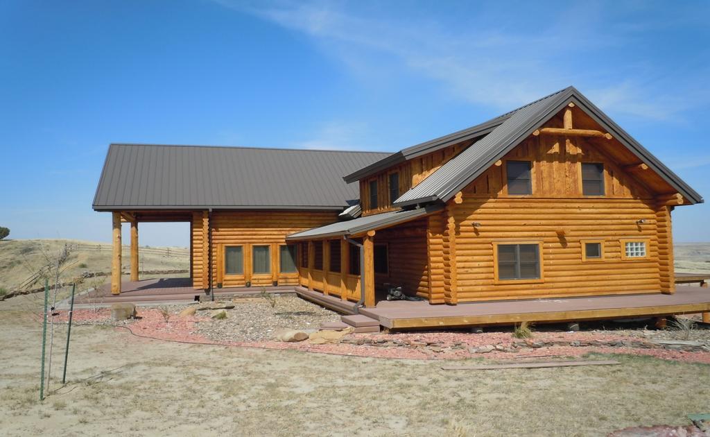 IMPROVEMENTS: Log Lodge built in 2008 consisting of 10,496 sq. ft. on three levels. It has 12 bedrooms, 7 full baths, and two half baths. Large family room with fireplace and vaulted ceilings.