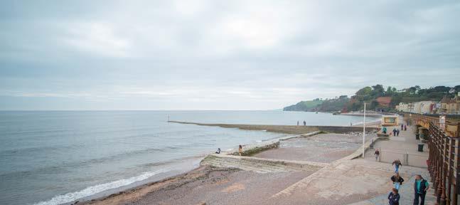 Location SOUTH COAST Dawlish is a popular seaside town on the south coast of Devon. The town is located between Torquay, 15 miles to the south, and Exeter, 12 miles to the north.