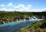 We drive further inland to the Hraunfossar and Barnafossar waterfalls and on through the Húsafell woodlands.
