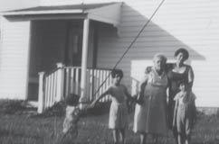 In this photo, Goly and I are watching Cristi walk. In front of the farmhouse in Flemington Papi rented part of a farmhouse for us in Flemington. We lived in one part of the house.
