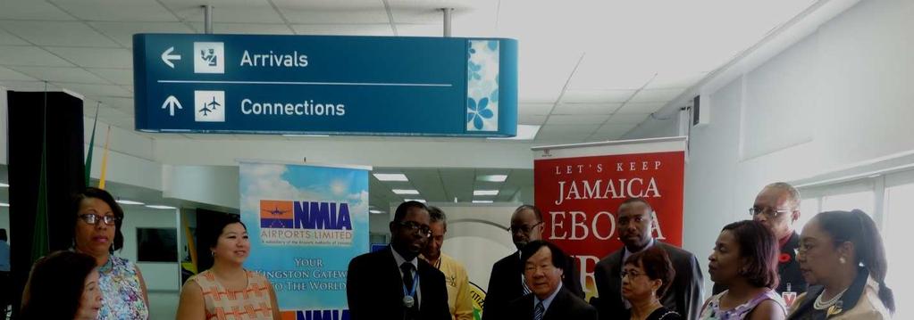 KINGSTON S NORMAN MANLEY INT L AIRPORT RECEIVES WALK-THROUGH FEVER SCAN MACHINE 20 October 2015 Norman Manley International Airport, Kingston Official Hand-Over of Fever Scan Machine to The