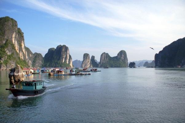 Scenic Destinations Halong Bay, Vietnam A UNESCO World Heritage Site, the one of the 2011 New Natural Wonders of The World by a local sightseeing boat to enjoy