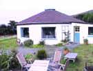 Dingle peninsula. Each cottage is decorated in a different, imaginative, theme, with antique furniture. On site there is a playground, tennis court and barbecue area.