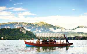 After lunch return back to Lake Bled to enjoy a traditional ride which is a wooden flat-bottom boat with a pointed bow and the stern widened. Visit the Church of St.
