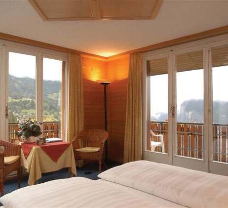 this alpine hotel. Facilities include comfortable lounges, a cosy bar and a dining room furnished in traditional wooden style.