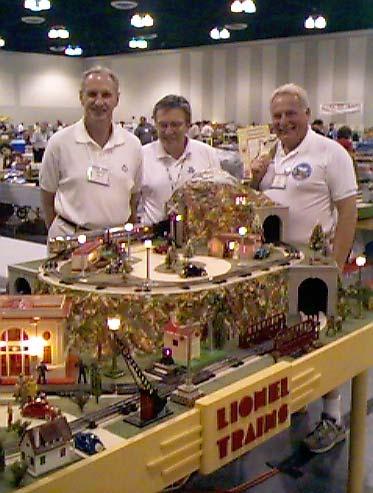 Page 2 the NOR-CAL EXPRESS E8 Courtesy of Ken Houghton Rail Images SIMULATED DEALER LAYOUT AT THE ONTARIO CONVENTION Your editor, Dave Pfeifer and John April are shown (L to R) admiring Robert Lihani