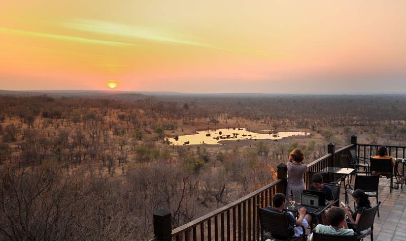 The rooms at the lodge all have private decks and views of the waterhole or surrounding bush. Victoria Falls Safari Lodge has two restaurants.