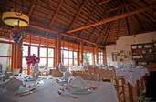 The main lodge, with a pool and ten thatch cottages, faces Lake Albert with magnificent views of the Blue Congo
