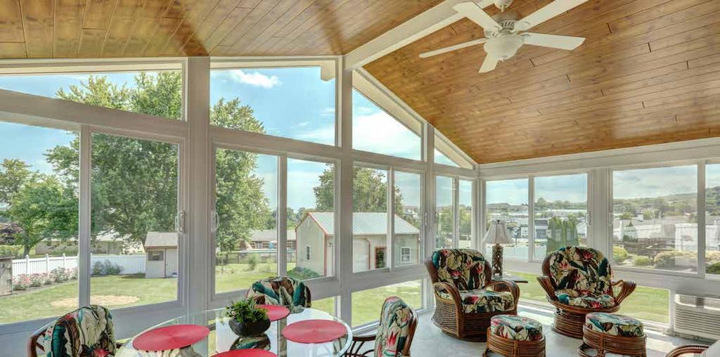 love the feel of your sunroom when you choose a natural wood grain look for the ceiling.