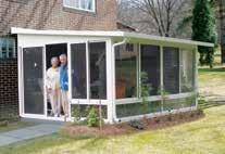 Motorized screens create a retractable screen room that keeps the bugs out.