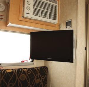 The front of the trailer features cabinetry and a wardrobe in