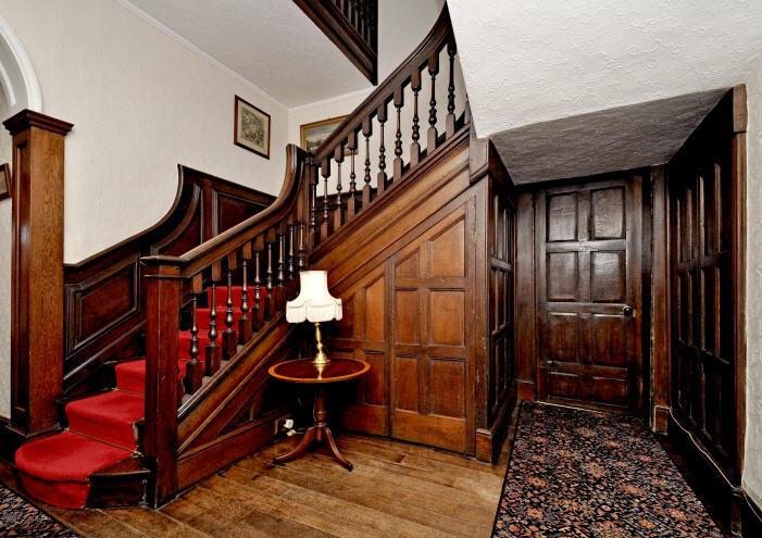 GROUND FLOOR ACCOMMODATION: Entrance Hall, Drawing Room with walnut parquet floor and large southerly bay window with French patio doors, oak panelled double aspect Dining Room, oak panelled Study,