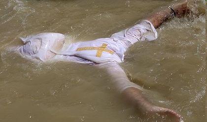Taking stock... Yet Christian pilgrims plunge into the polluted river thereby risking infection.