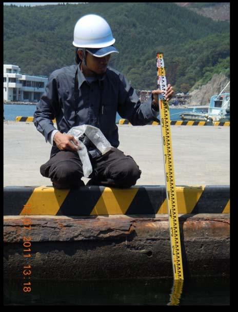 Water mark from tsunami about 8.0m Figure 9: Measurement of tsunami terrace (Photo taken by Mazni Azis) Figure 10: Because of subsidence, sea level is only about 35cm from the road.