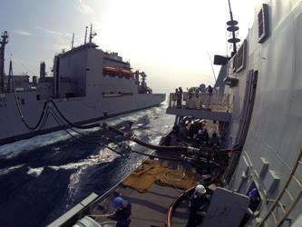 HMS Dauntless carrying out a replenishment at sea with the US Navy s tanker Charles Drew.